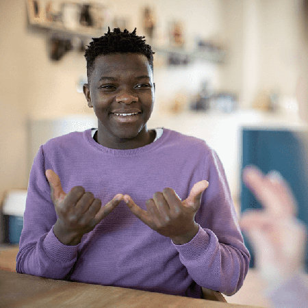 Young man doing sign language